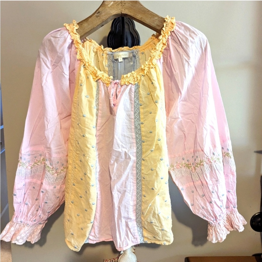 loveshackfancy pastel blouse with embroidery and ruffles